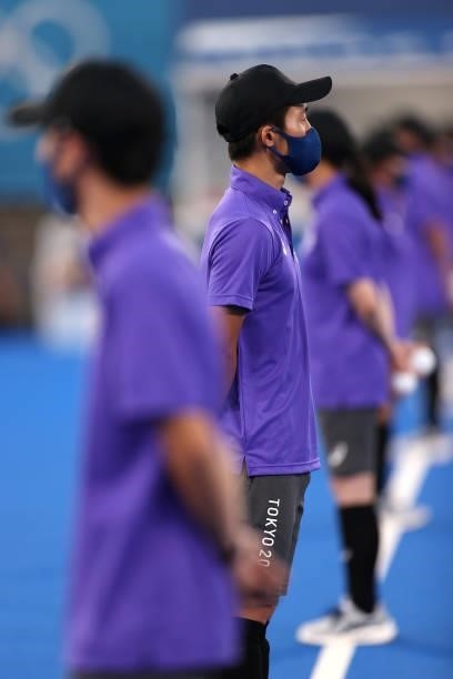 Ball carriers line up on pitch prior to the Men's Preliminary Pool A match between Japan and Argentina on day two of the Tokyo 2020 Olympic Games at...