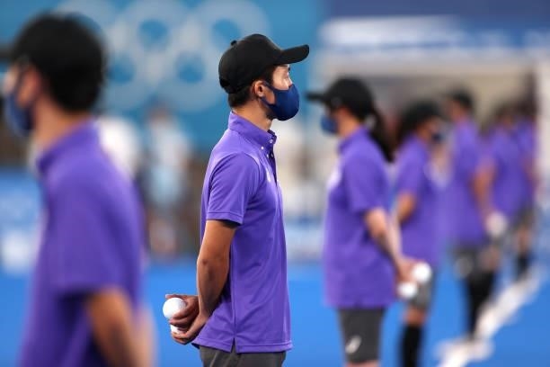 Ball carriers line up on pitch prior to the Men's Preliminary Pool A match between Japan and Argentina on day two of the Tokyo 2020 Olympic Games at...