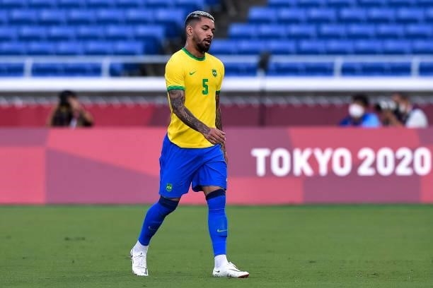 Douglas Luiz of Brazil leaves the pitch after receiving a red card during the Tokyo 2020 Olympic Mens Football Tournament match between Brazil and...