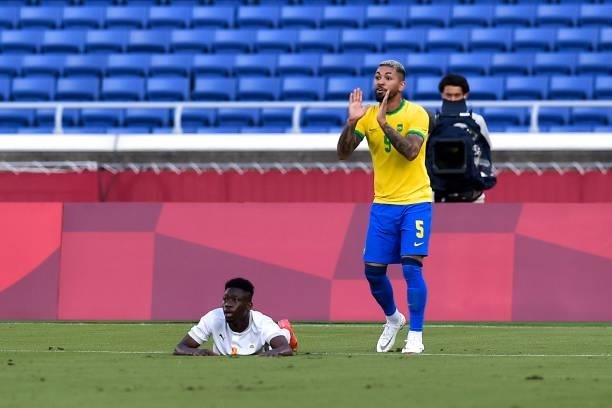 Youssouf Dao of Ivory Coast lies on the ground after being fouled by Douglas Luiz of Brazil during the Tokyo 2020 Olympic Mens Football Tournament...