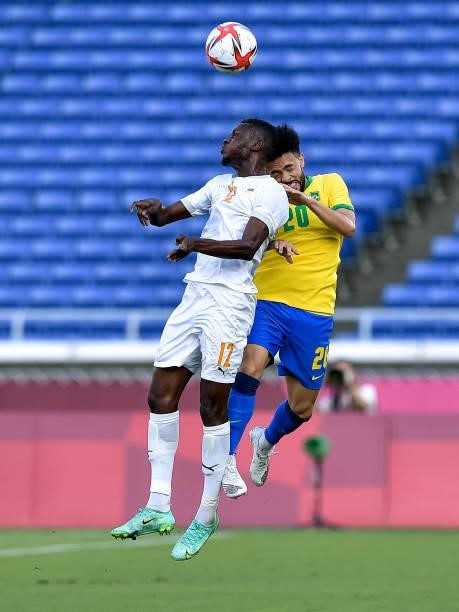 Eboue Kouassi of Ivory Coast competes for the headed ball with Claudinho of Brazil during the Tokyo 2020 Olympic Mens Football Tournament match...