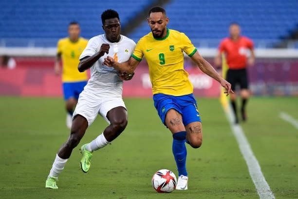 Wilfried Singo of Ivory Coast and Matheus Cunha of Brazilbattle for possession during the Tokyo 2020 Olympic Mens Football Tournament match between...