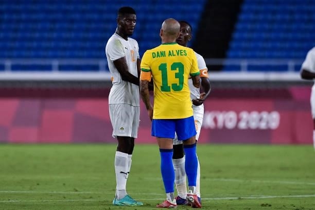 Eboue Kouassi of Ivory Coast, Dani Alves of Brazil and Max Gradel of Ivory Coast during the Tokyo 2020 Olympic Mens Football Tournament match between...