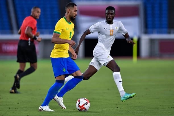 Matheus Cunha of Brazil and Eboue Kouassi of Ivory Coast during the Tokyo 2020 Olympic Mens Football Tournament match between Brazil and Ivory Coast...