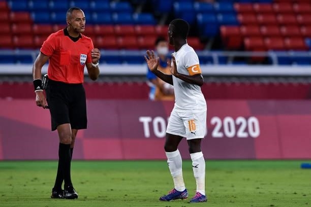 Referee Ismail Elfath of USA and Max Gradel of Ivory Coast during the Tokyo 2020 Olympic Mens Football Tournament match between Brazil and Ivory...