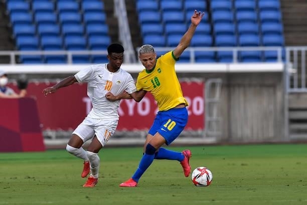 Amad Diallo of Ivory Coast and Richarlison of Brazil during the Tokyo 2020 Olympic Mens Football Tournament match between Brazil and Ivory Coast at...