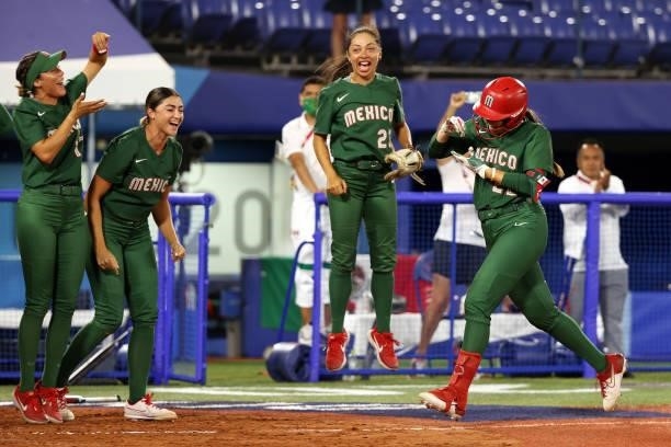 Brittany Cervantes of Team Mexico celebrates after hitting a home run in the fifth inning against Team Italy during the Softball Opening Round on day...