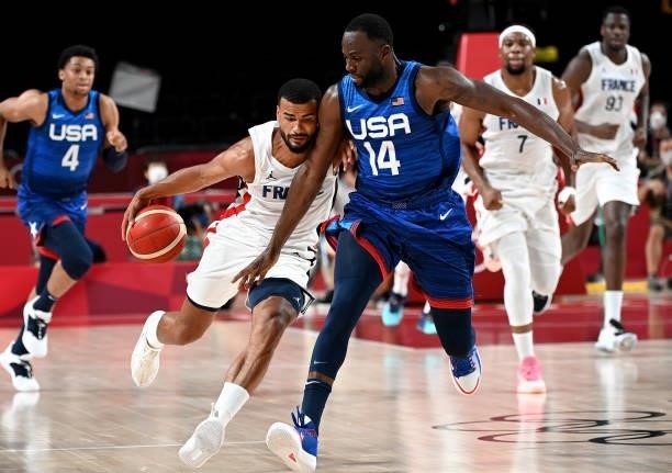 Timothe Luwawu Kongbo of France is challenged by Jamal Green of the USA during the preliminary rounds of the Men's Basketball match between the USA...