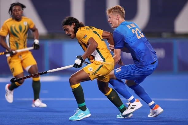 Mustaphaa Cassiem of Team South Africa holds off Joep Paul Eric de Mol of Team Netherlands on their way to scoring their team's first goal during the...