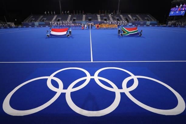 Players of both teams line up on pitch for national anthems prior to the Men's Preliminary Pool B match between South Africa and the Netherlands on...
