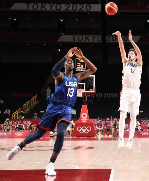 Nando de Colo of Team France shoots over Bam Adebayo of Team United States during the first half of the Men's Preliminary Round Group B game on day...