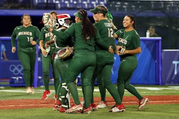 Starting pitcher Dallas Escobedo of Team Mexico celebrates with teammates after the final out to defeat Team Italy 5-0 during the Softball Opening...