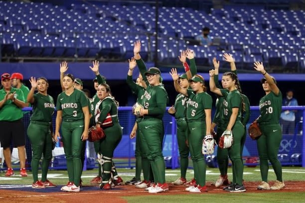 Team Mexico acknowledges Team Italy after defeating them 5-0 during the Softball Opening Round on day two of the Tokyo 2020 Olympic Games at Yokohama...