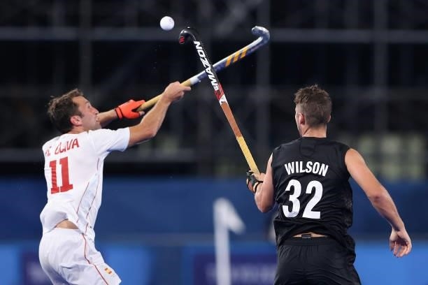 Roc Oliva Isern of Team Spain and Nick Wilson of Team New Zealand battle for the ball during the Men's Preliminary Pool A match between Spain and New...