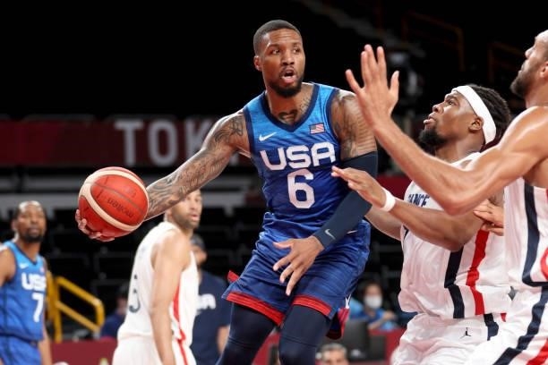 Damian Lillard of Team United States looks to pass against Team France during the first half of the Men's Preliminary Round Group B game on day two...