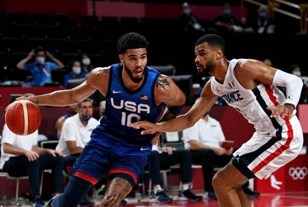 Jayson Tatum of the USA takes on the defence of Timothe Luwawu Kongbo of France during the preliminary rounds of the Men's Basketball match between...