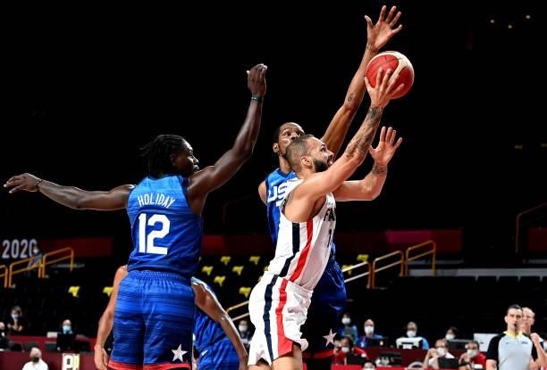 Evan Fournier of France attempts to break through the defence during the preliminary rounds of the Men's Basketball match between the USA and France...