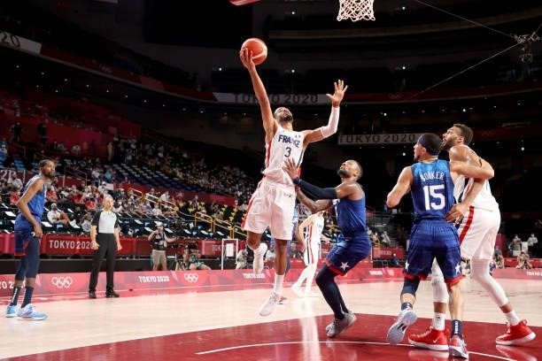 Timothe Luwawu Kongbo of Team France drives to the basket against Damian Lillard of Team United States during the first half of the Men's Preliminary...