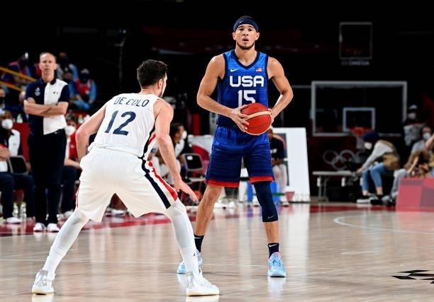 Devin Booker of the USA looks to pass during the preliminary rounds of the Men's Basketball match between the USA and France on day two of the Tokyo...