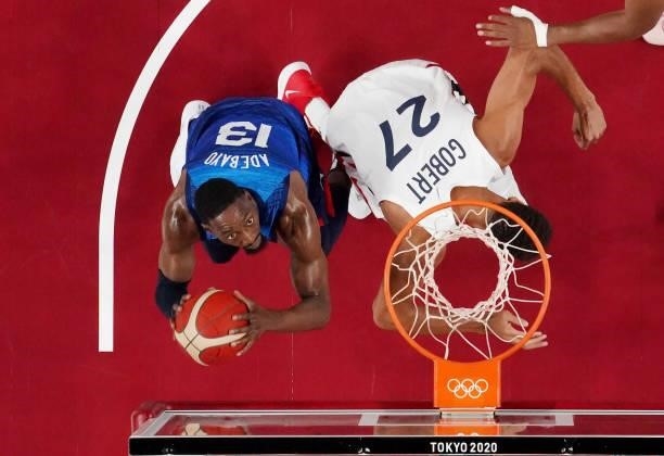 Bam Adebayo of Team United States looks to shoot the ball over Rudy Gobert of Team France during the first half of the Men's Preliminary Round Group...