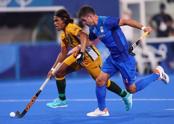 Mustaphaa Cassiem of Team South Africa and Robbert Kemperman of Team Netherlands battle for the ball during the Men's Preliminary Pool B match...