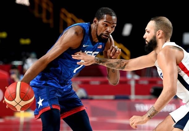 Kevin Durant of the USA takes on the defence of Evan Fournier of France during the preliminary rounds of the Men's Basketball match between the USA...