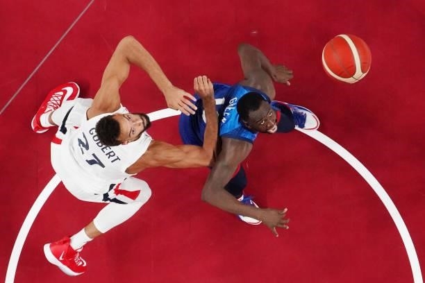 Rudy Gobert of Team France and Draymond Green of Team United States eye the ball during the first half of the Men's Preliminary Round Group B game on...