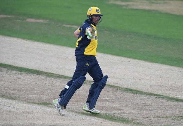 Tom Cullen of Glamorgan celebrates reaching his 50 during the Royal London Cup match between Northamptonshire and Glamorgan at The County Ground on...