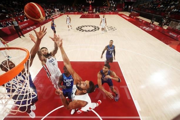 Vincent Poirier and Rudy Gobert of Team France go up for a rebound over Jrue Holiday, Bam Adebayo and Jayson Tatum of Team United States during the...