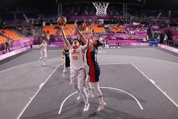 Zhiting Zhang of Team China drives to the basket during the Women's Pool Round match between China and France on day two of the Tokyo 2020 Olympic...