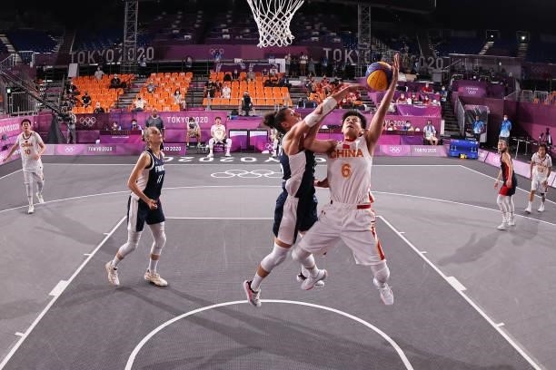 Shuyu Yang of Team China drives to the basket during the Women's Pool Round match between China and France on day two of the Tokyo 2020 Olympic Games...