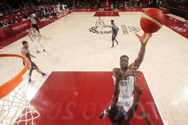 Moustapha Fall of Team France shoots over Jrue Holiday of Team United States during the second half of the Men's Preliminary Round Group B game on...