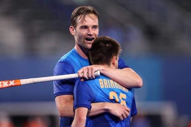 Mirco Pruijser of Team Netherlands celebrates with teammate Thierry Brinkman after scoring their team's fifth goal during the Men's Preliminary Pool...