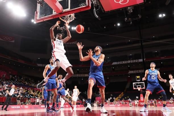 Moustapha Fall of Team France dunks the ball over JaVale McGee of Team United States during the second half of the Men's Preliminary Round Group B...