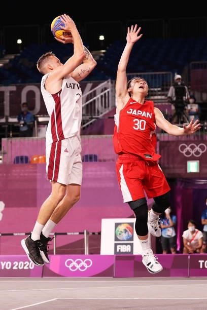 Karlis Lasmanis of Team Latvia shoots during the Men's Pool Round match between Latvia and Japan on day two of the Tokyo 2020 Olympic Games at Aomi...