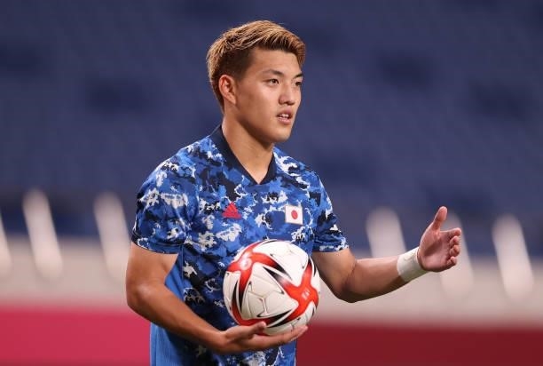 Ritsu Doan of Team Japan prepares to take a throw in during the Men's First Round Group A match between Japan and Mexico on day two of the Tokyo 2020...