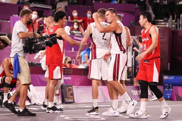 Team Latvia celebrate victory after defeating Team Japan during the Men's Pool Round match between Latvia and Japan on day two of the Tokyo 2020...