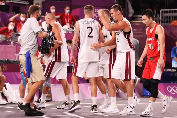 Team Latvia celebrate victory after defeating Team Japan during the Men's Pool Round match between Latvia and Japan on day two of the Tokyo 2020...