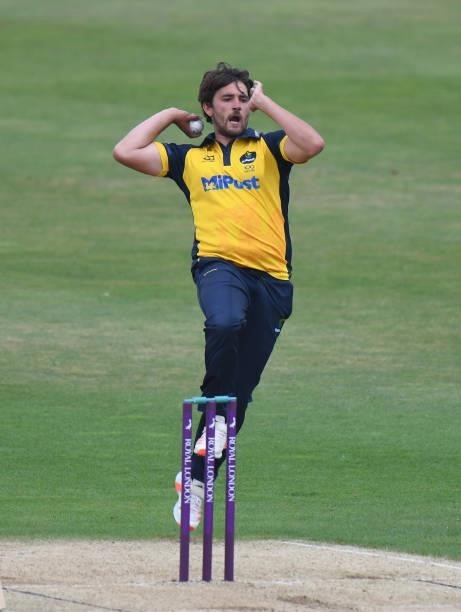 Lukas Carey of Glamorgan b0wls during the Royal London Cup match between Northamptonshire and Glamorgan at The County Ground on July 25, 2021 in...