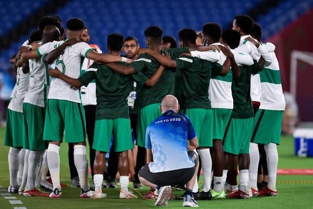 Abdulelah Al Amri of Saudi Arabia forms a huddle with his team during the Tokyo 2020 Olympic Mens Football Tournament match between Saudi Arabia and...