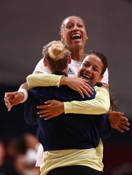 Amandine Leynaud, Cleopatre Darleux and Beatrice Edwige of Team France celebrate together after winning Women's Preliminary Round Group B match...
