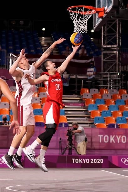 Keisei Tominaga of Team Japan drives to the basket during the Men's Pool Round match between Latvia and Japan on day two of the Tokyo 2020 Olympic...