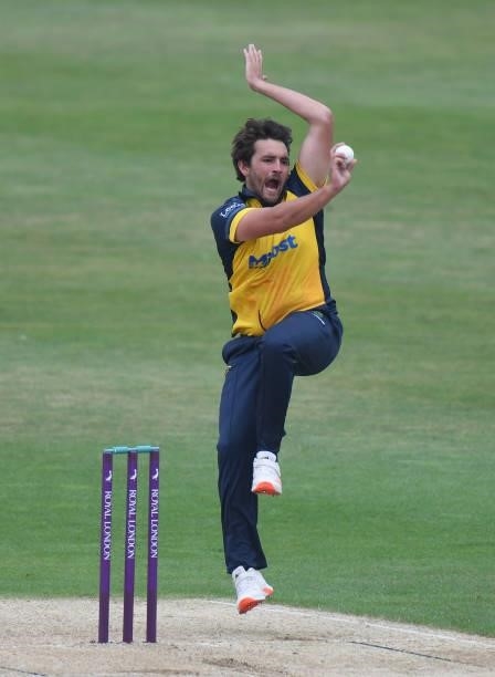 Lukas Carey of Glamorgan bowls during the Royal London Cup match between Northamptonshire and Glamorgan at The County Ground on July 25, 2021 in...