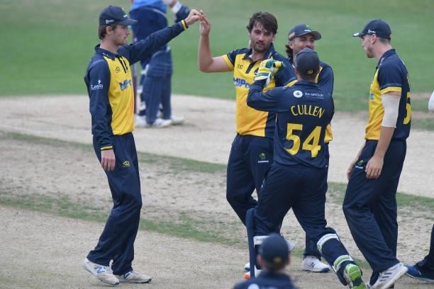 Lukas Carey of Glamorgan celebrates taking the wicket of Ricardo Vasconcelos of Northamptonshire during the Royal London Cup match between...