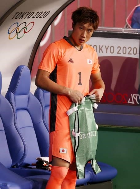Keisuke Osako of Team Japan looks on from the bench prior to the Men's First Round Group A match between Japan and Mexico on day two of the Tokyo...