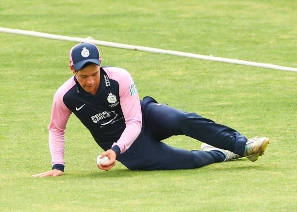 Jack Davies of Middlesex blocks the ball from going out of the boundary during the Royal London Cup match between Essex and Middlesex at Cloudfm...