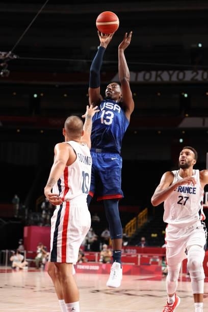Bam Adebayo of Team United States takes a jump shot over Evan Fournier of Team France during the second half of the Men's Preliminary Round Group B...