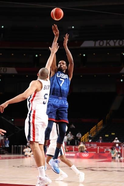 Kevin Durant of Team United States takes a jump shot over Nicolas Batum of Team France during the second half of the Men's Preliminary Round Group B...