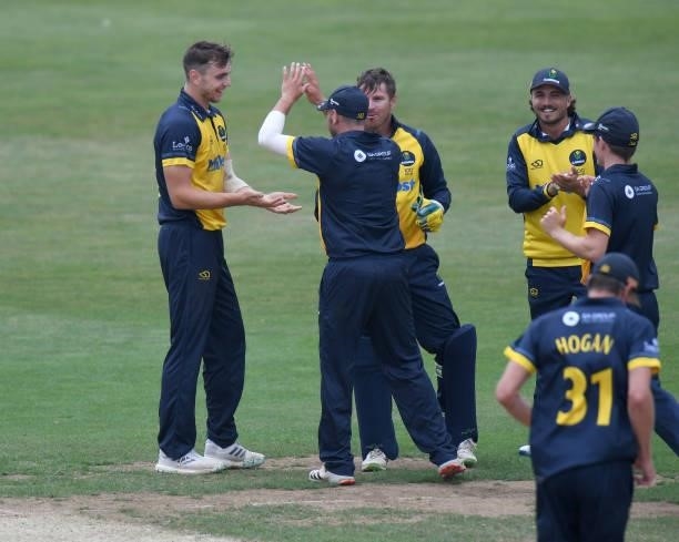 Joe Cooke of Glamorgan celebrates taking the wicket of Ben Curren of Northamptonshire during the Royal London Cup match between Northamptonshire and...