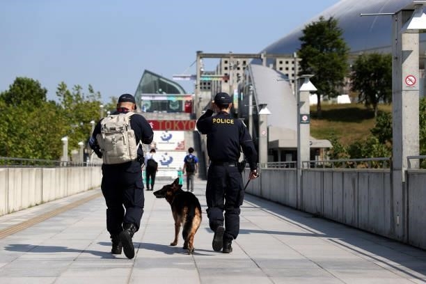 Police Officers are seen with a dog outside the stadium prior to the Men's First Round Group C match between Egypt and Argentina on day two of the...